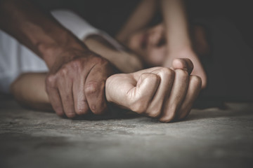 man's hand holding a woman hand for rape and sexual abuse, hands for rape and sexual abuse concept, 