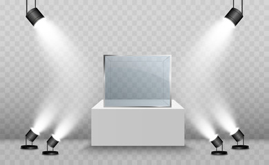 Glass showcase for the exhibition in the form of a cube. Background for sale illuminated by spotlights. Museum glass box isolated advertising or business design boutique. Exhibition hall.