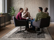 © JonoErasmus - Diverse group of smiling businesspeople having a casual meeting