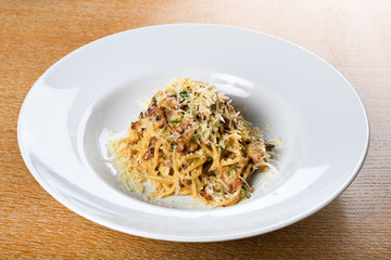 Wall Mural - Spaghetti carbonara, specific authentic traditional italian: bacon, egg, parmesan shavings