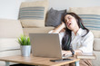 © PRIME STOCK LAB - Beautiful young asian employee in casual wear feeling tired exhausted during working day in home office. Working from home concept