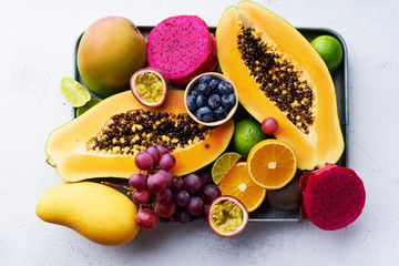 Flat lay with variety of fresh tropical fruits