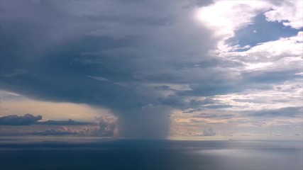 Sticker - Aerial hyperlapse of clouds and rain over sea 