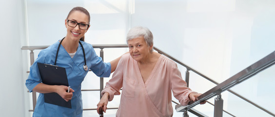 Sticker - Doctor helping senior patient in modern hospital. Banner design