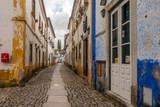 Fototapeta Uliczki - Street views, castle walls and churches of Obidos, Portugal.