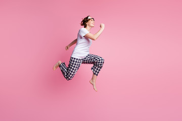 Sticker - Full size profile photo of funny lady jump high up rush sales shopping didn't change sleep clothes wear sleep mask white t-shirt plaid pajama pants barefoot isolated pink color background