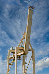 Poster - Yellow Loading Crane against sky