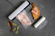 Vacuum packaging of fish. The use of a vacuum sealer for long-term storage of products. Top view.