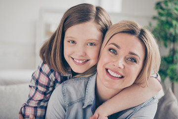 Poster - Closeup photo of domestic attractive blond lady mommy daughter comfy couch hugging piggyback stay home quarantine spend weekend together overjoyed best friends living room indoors