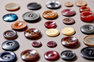Fototapete - Background and texture of multicolored antique buttons