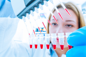 Wall Mural - Girl lab technician at the clinic's microbiology laboratory