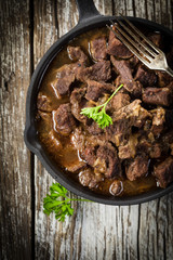 Canvas Print - Beef stew in a cast iron skillet.