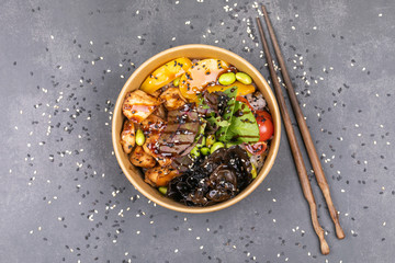 Wall Mural - Poke bowl with chicken and vegetables on the white table.