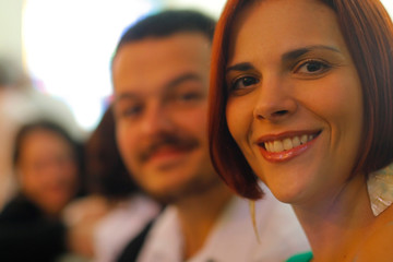 beautiful red-haired woman smiling, narrow focus