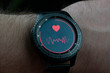 © Igor - smart watch on hand measure blood pressure dark close-up background