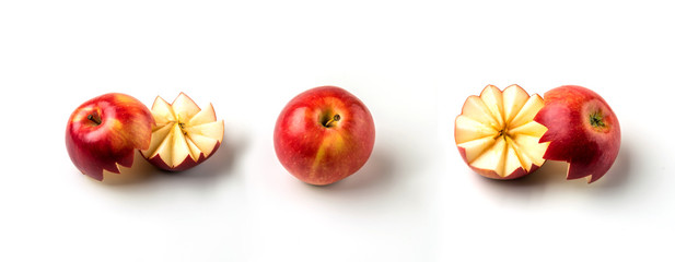 Wall Mural - A whole red apple and a cut apple on a white background.