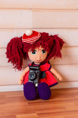 Wall Mural - Handmade doll Amigurumi girl sitting.