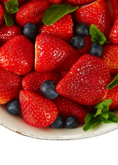 Wall Mural - fresh strawberries and blueberries isolated no white