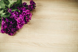 Fototapeta Lawenda - lilac flowers on wooden background
