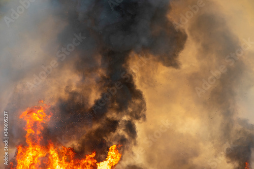 Fotomural raging dust smoke pattern background of fire burn in grass fields, forests and b