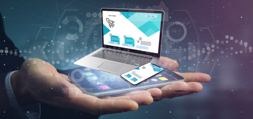 Businessman holding a Laptop and a smartphone - 3d rendering