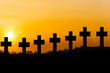 Holy place. Cemetery concept: cross at sunset.