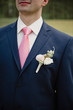 © malysheva - Wedding in the spring. The groom in a blue suit and pink tie. Portrait.