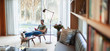 © Paul Bradbury/Caia Image - Man relaxing, listening to music with headphones and mp3 player in living room