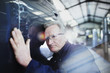 © Tom Merton/Caia Image - Focused male mechanic examining car in auto repair shop