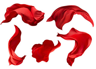 Red fabric flying on the wind. Isolated on white background