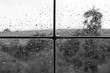 © leomalsam - Rainy weather behind wet glass of a house window