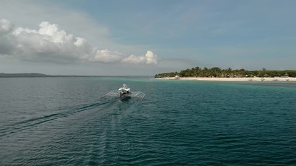 Wall Mural - Flying over tourist boat next to Virgin island, Cebu, Philippines 