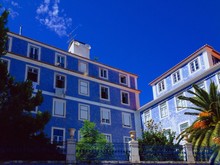 Low Angle View Of Buildings Against Blue Sky