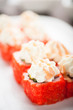 © Markel - Uramaki sushi ikura maki on a dish