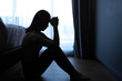 © jaboo_foto - silhouette sad scared and worried woman sitting in dark bedroom , Stay at home quarantine coronavirus pandemic prevention