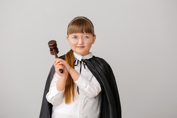 Sticker - Portrait of little judge on grey background