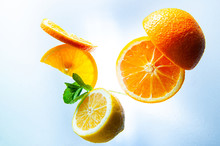 Lemon, Orange And Mint On A Light Background Top View And Close Up