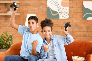 Poster - African-American teenagers playing video game at home