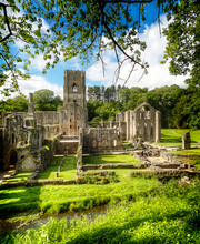 Historic Ruins Of Fountains Abbey Amidst Trees