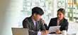 © Prathankarnpap - Photo of business people working with computer laptop and tablet while sitting together at the white working desk over comfortable office as background.