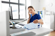 © Syda Productions - medicine, technology and healthcare concept - female doctor or nurse with computer and clipboard calling on phone at hospital