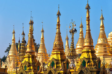 Wall Mural - Myanmar, Yangon, elements of Golden Pagoda The Shwedagon against the blue sky . Shwedagon Pagoda is the most sacred Buddhist pagoda in Myanmar