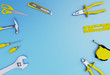 © BOX39 studio - Many  yellow hand tools on a blue background, there is space for your ad.