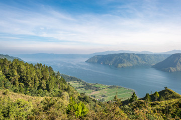 Wall Mural - View from the island of Samosir to Lake Toba, the largest volcanic lake in the world situated in the middle of the northern part of the island of Sumatra in Indonesia