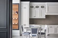 Italian Kitchen In Classic Style With White Painted Facades With A Dining Table For 4 People