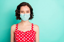 Close Up Portrait Of Fascinating Young Wonderful Lady Posing In Front Of Camera Show Covid-19 Self-isolation Wear Fabric Mask Isolated With Teal Background