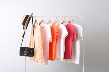 Wall Mural - fashion clothes on a rack in a light background indoors. place for text