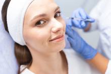 Woman Posing For The Camera During A Cosmetic Procedure