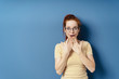 © contrastwerkstatt - Young woman reacting in awe and astonishment