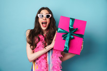 Image Of Surprised Woman In Sunglasses Holding Gift Box